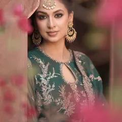 Golden glow, green dreams, and a whole lot of mehendi charm. This close-up shot shows the beautifully defined eye makeup that complements the traditional green outfit.