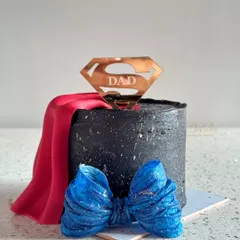 Another look at our Superman "Dad" cake, complete with a flowing red cape and a blue bow tie.