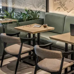 Seating at this CCD outlet is all about flexibility and comfort. We introduced a combination of plush bench seating and sleek chairs to suit every guest, whether they are there for a cozy chat or to work.