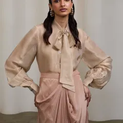 A classic portrait for the same collection, focusing on the details of the blouse and the model's confident expression. This is a key shot for any lookbook.