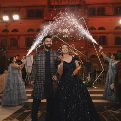 A sparkling entry for a glamorous couple. I used cold pyro fountains to frame their entrance, making them shine against the backdrop of a royal palace setting for their sangeet night.