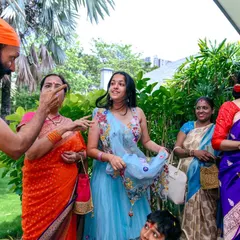 A moment of interaction and blessing during a thread ceremony. I focus on capturing the important rituals and the emotions that accompany them.