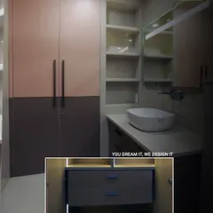 This image showcases a smart and stylish storage solution for a kid's bathroom. The design includes a vanity with organized drawers and an adjacent wardrobe, blending functionality with a chic, modern aesthetic.