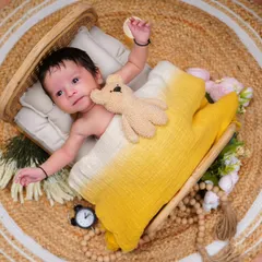 A slightly different angle of our awake newborn, showing his delicate features and curious expression.