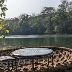 A unique floating breakfast experience in a coracle on the serene waters of the Kali River at the Dandeli adventure camp.