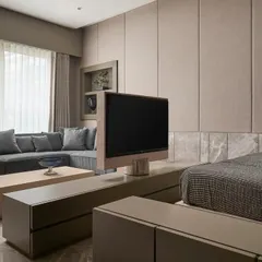 This is the guest room side of the rotating TV console. The custom unit allows the television to be enjoyed from the bed, making the space a private retreat for visitors while maintaining a clean, uncluttered look.