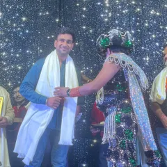 Receiving a shawl from Magician Ajooba ji on stage. This gesture of respect from a senior artist means the world to me.