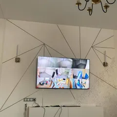 For home installations, we can connect your CCTV system directly to a TV. This setup in a living room allows the homeowner to quickly check all camera feeds from a central, convenient location.
