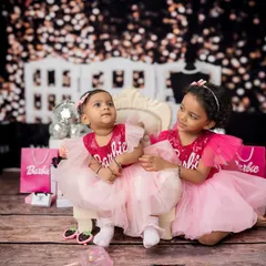 A candid moment from the Barbie shoot, capturing the sweet interaction between sisters.