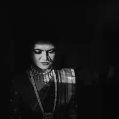 A slightly different take on the dramatic light portrait. This black and white photo of Kinjal has a quiet, introspective feel, highlighting the beautiful details of her bridal jewelry.