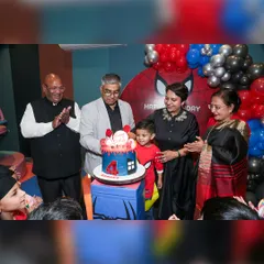The cake-cutting moment is the centerpiece of the party. Here, Sarang is surrounded by his family as they celebrate his fourth birthday with a spectacular Spiderman cake.