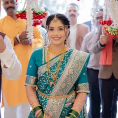 The bride's grand entrance. Her makeup is designed to be radiant and picture-perfect from every angle.