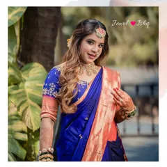 A portrait of our stunning bride Aishwarya for her Sakharpuda. She is wearing a traditional temple jewellery choker, jhumkas, and a bindi-style maang tikka with her royal blue Paithani saree.