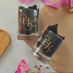 These hand-engraved whiskey glasses feature a custom monogram designed for a couple. It's a classic and elegant gift, perfect for celebrating a special bond.