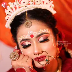 I will teach you the art of traditional Bengali bridal makeup, focusing on the iconic large, expressive eyes and the intricate 'Chandan' designs on the forehead that are central to this beautiful cultural look.