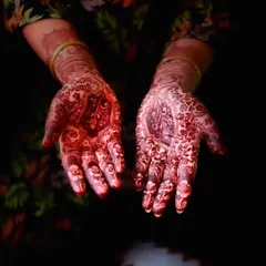 A dramatic shot showcasing the beautiful, dark stain of a traditional design against a dark background. The color is rich and even.