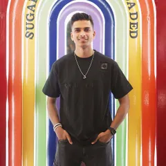 Too glam to give a damn. A confident portrait against the rainbow arches at Sugar Factory, reflecting my bold personality.
