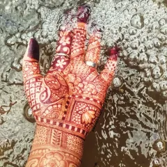 An artistic shot of the fresh henna stain against the water. You can see the clarity of the lines and the beautiful initial color.