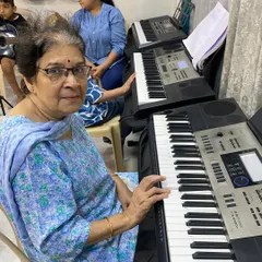 We welcome students of all ages, and it's a joy to see everyone discover their passion for music. This student is in one of our keyboard classes, proving that it's never too late to start learning a new skill.