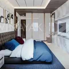 Your bedroom should be your personal sanctuary. We layered textures, from the tufted headboard to the plush bedding, and used a mix of ambient and focused lighting to create a tranquil retreat that feels both spacious and intimate.