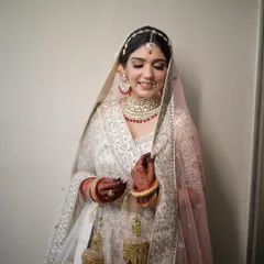 A quiet moment with her beautiful kalire. The makeup is soft and romantic, with a pop of color from the ruby jewelry that we tied in with a rosy lip.