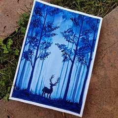 A monochromatic watercolor painting of a misty blue forest with a deer silhouette. I used varying shades of a single color to build depth and atmosphere, creating a peaceful and mysterious woodland scene perfect for home decor.