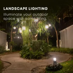 Landscape lighting is essential for enjoying your garden at night. In this design, hanging lanterns and subtle uplighting on trees create a warm, inviting ambiance, highlighting the garden's best features and extending its usability into the evening.