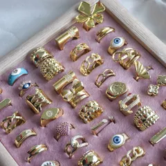 Make a statement with our new drop. This tray is filled with our latest collection of gold rings, featuring bold designs, chunky bands, and unique shapes that are sure to get you noticed.