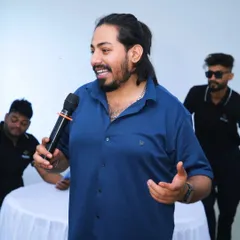 Getting up close and personal with the audience is my specialty. This candid shot captures me interacting with guests, making sure everyone feels included. For me, being a party host is all about creating connections and making people smile.
