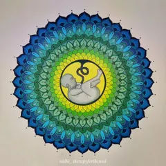 A direct, close-up view of the mandala, showing the fetus at its center surrounded by layers of intricate patterns in calming shades of green and blue.