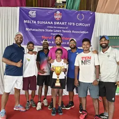 The entire Belief Tennis Academy coaching team with our U-10 champion, Trisha Bhosale.