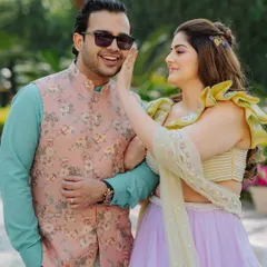 A playful and happy moment. The makeup is designed to be fun and light, perfect for a daytime event filled with laughter and dancing.