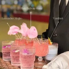 A tray of my signature mocktails, ready to be served. Here you can see the floral Lavender Mojito, the whimsical Pink Bubblegum with cotton candy, and the creamy Vanilani.