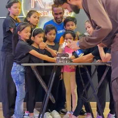 The instructors are just big kids at heart. Here is our team lighting the cake during the Children's Day celebration, surrounded by our excited students.