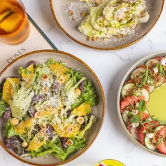 A fresh and vibrant brunch spread. Featuring our citrus and hazelnut salad, a classic Caesar, and a watermelon and feta composition, all perfect for a light yet satisfying Sunday meal.