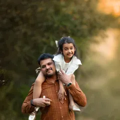 The classic shoulder-ride! A father-daughter portrait like this is always a favorite, full of pride and happiness.