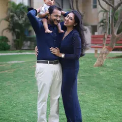 The best seat in the house! A playful moment during an outdoor family session, with the little boy sitting happily on his dad's shoulders.
