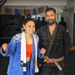 Posing with a student after a tough gi training session. I believe that we build strength through adversity and that our weaknesses, when confronted, become our greatest assets. This philosophy is at the heart of our team.