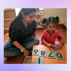 Our new batch starts soon. This is your opportunity to join an 80-year legacy of excellence and become a certified Montessori educator. The image shows a teacher guiding a child with sandpaper numbers, an activity you will master in our course.