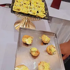 A platter of assorted chaat, including dahi puri and sev puri canapés. I provide a variety of street food style snacks that are always a hit at corporate events.