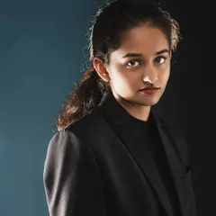 A more formal, moody studio portrait. Here, I used a specific lighting setup to create deep shadows and a strong, focused look, perfect for a professional headshot or portfolio.