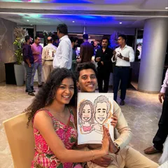 The smiles say it all. This couple enjoyed getting their portrait drawn live during an evening celebration, adding a touch of interactive fun for them and their guests.
