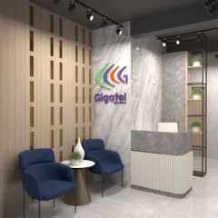 The reception area for Gigatel, featuring a marble-patterned wall, wood slat details, and a modern desk, creating a professional and stylish first impression.