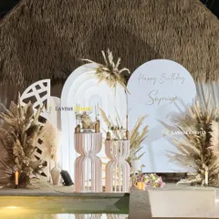 This is my signature boho chic style, perfect for an elegant poolside birthday. I use earthy tones, pampas grass, and custom-designed props to create a vibe that is both relaxed and incredibly stylish.