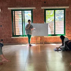 A student leads a discussion on yogic concepts. We believe in fostering authentic voices, as each person's unique perspective makes the learning process richer and more alive.