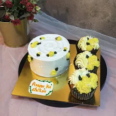 A cute and simple set for a "Chiksa" or Haldi ceremony. This order included a small bento cake and matching cupcakes, all decorated with a cheerful yellow and white theme.