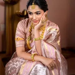 A pensive and beautiful portrait. The makeup here is all about enhancing natural beauty, with a focus on flawless skin and softly defined features.