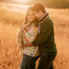 I believe the best light for capturing love is the sun's golden farewell. This intimate moment between an expecting couple, wrapped in the warm glow of sunset in a quiet field, is the kind of timeless, romantic memory I strive to create.