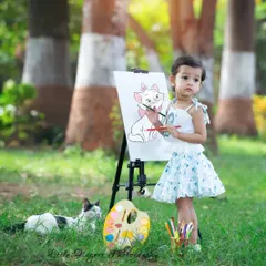 A little artist with her furry friend watching over her. I always welcome pets into our sessions, as they are such an important part of the family and create truly heartwarming photos.