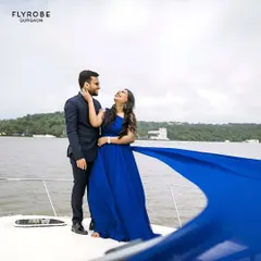 Create a cinematic moment with this royal blue trail gown. It’s perfect for a pre-wedding shoot on a boat or by the water, with the long trail catching the wind beautifully.